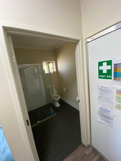 Accessible bathroom and first aid station in Lifestyle Solutions four-bedroom Supported Independent Living (SIL) house in Silkstone, Qld